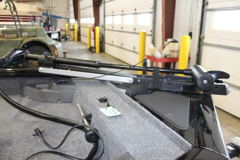 Slide: The Image of 2025 Tracker Pro Team 175 boat interior with mounted equipment in a garage setting. - 8