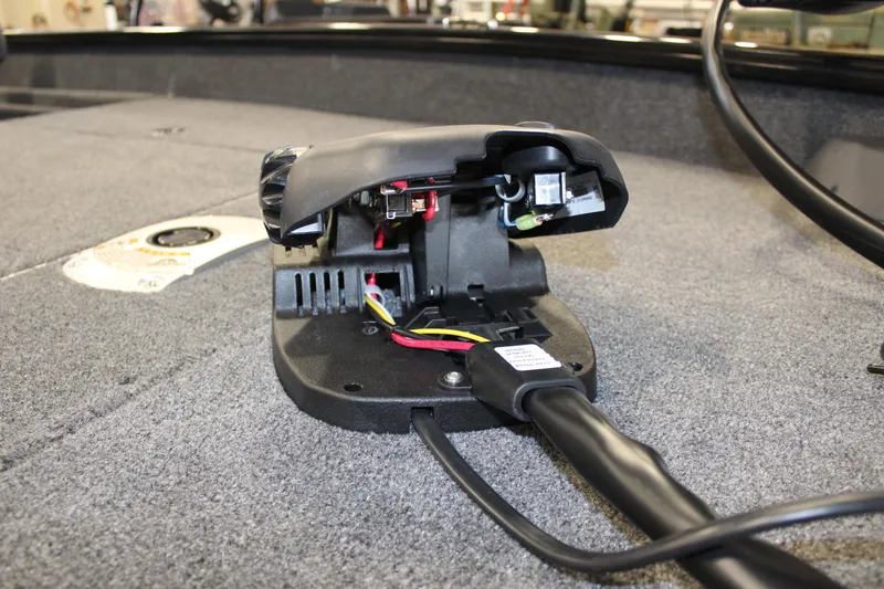 Slide: The Image of 2025 Tracker Pro Team 175 boat wiring detail on carpeted deck. - 9
