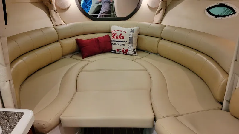 Slide: The Image of 2008 Monterey 315 Sport Yacht interior with beige leather seating and decorative pillows. - 11