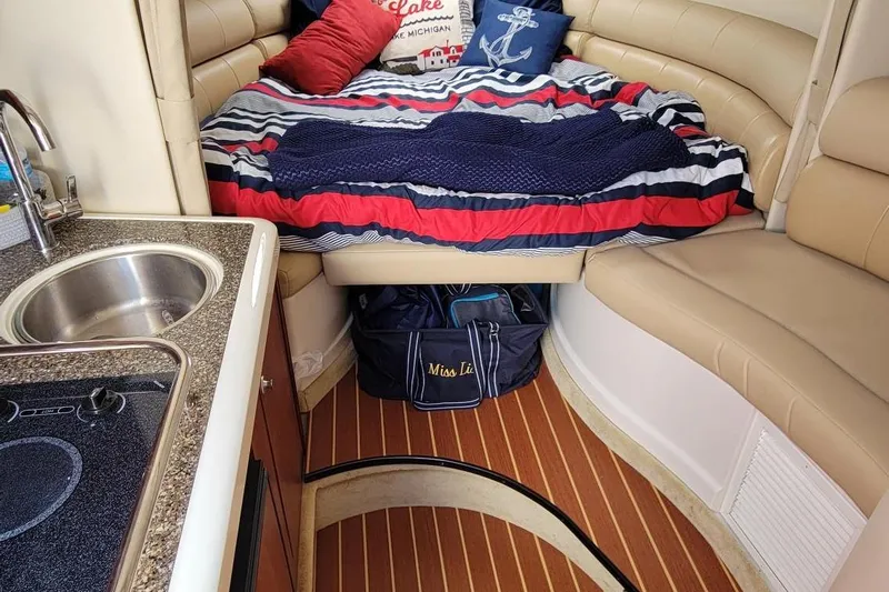 Slide: The Image of Interior of 2008 Monterey 315 Sport Yacht with cozy bed and kitchenette. - 12
