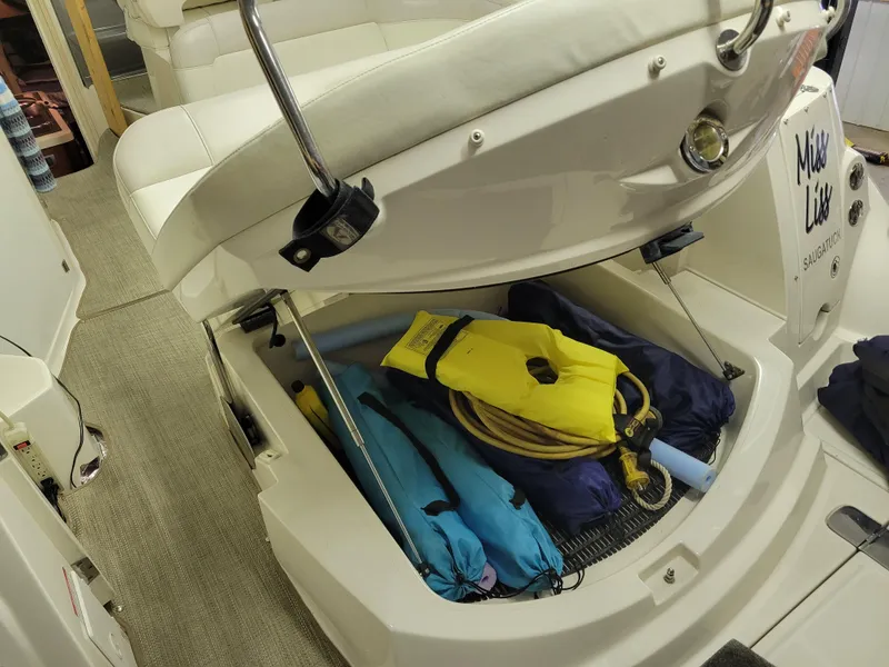 Slide: The Image of Storage compartment of a 2008 Monterey 315 Sport Yacht with life jackets and equipment. - 17