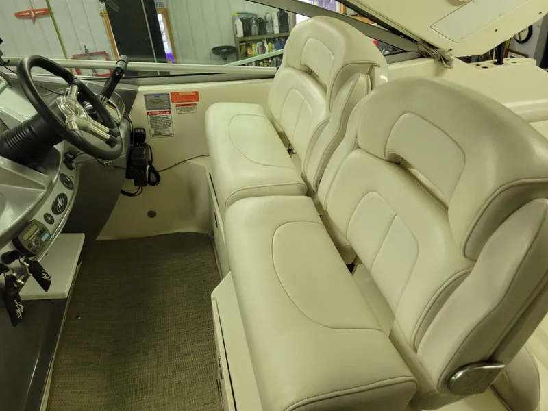 Slide: The Image of 2008 Monterey 315 Sport Yacht interior with white leather seating and steering wheel. - 22
