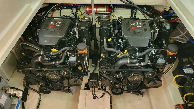 Slide: The Image of Engine compartment of a 2008 Monterey 315 Sport Yacht, featuring dual 5.0 MPI engines. - 24