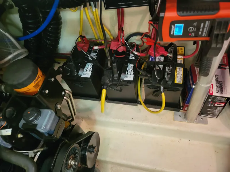 Slide: The Image of Engine compartment of a 2008 Monterey 315 Sport Yacht with batteries and wiring. - 27