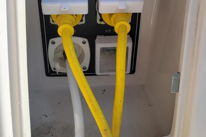 Slide: The Image of Electrical connections on a 2008 Monterey 315 Sport Yacht with yellow power cables. - 30