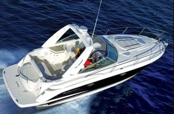 Slide: The Image of 2008 Monterey 330 Sport Yacht cruising on open water, aerial view. - 32