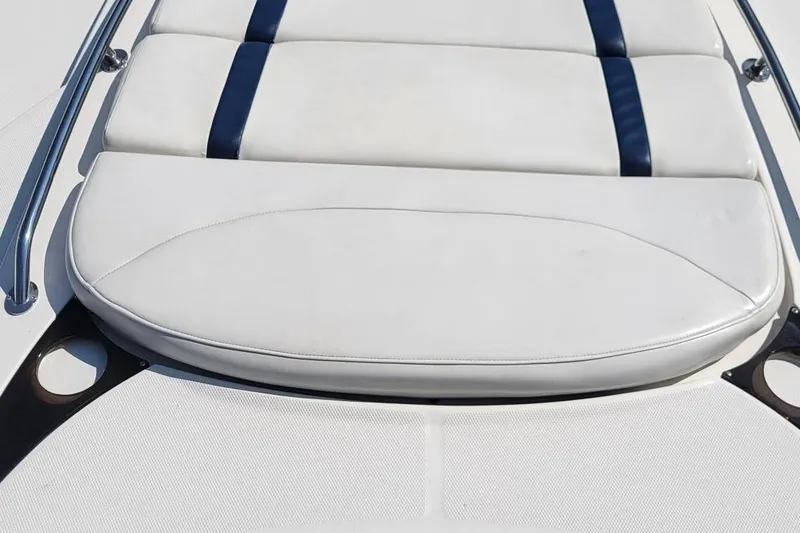 Slide: The Image of 2008 Monterey 315 Sport Yacht, white cushioned seating with blue accents. - 5