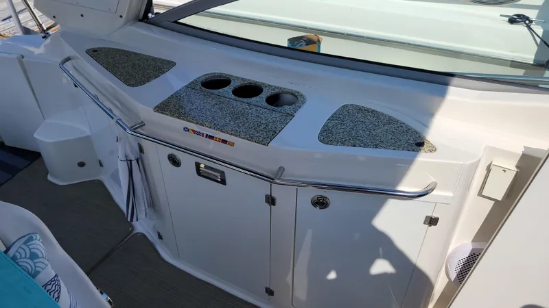 Slide: The Image of 2008 Monterey 315 Sport Yacht interior with granite countertop and storage compartments. - 7