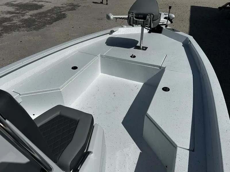 Slide: The Image of 2025 Xpress H22B boat interior with seating and storage compartments. - 12
