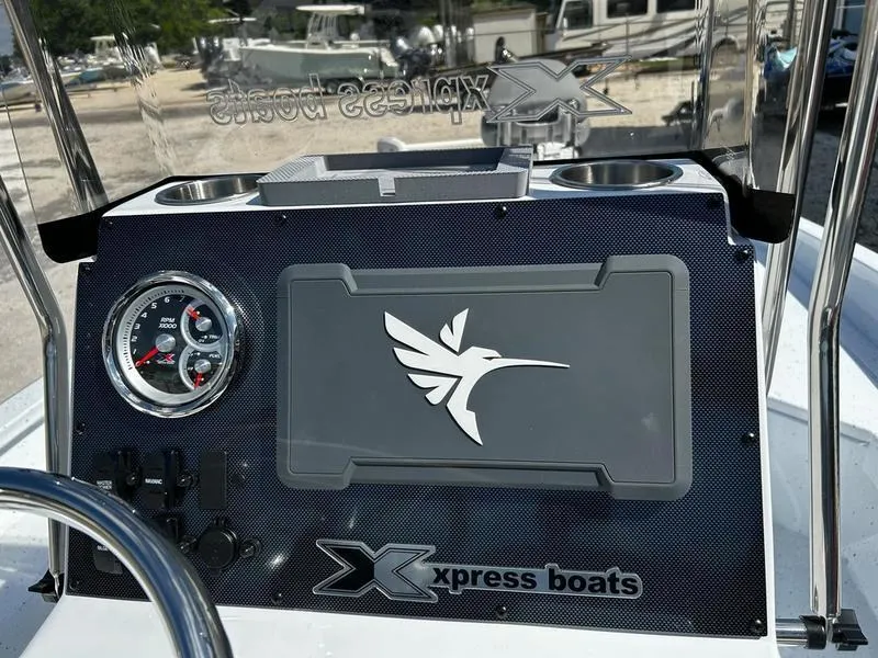 Slide: The Image of 2025 Xpress H22B boat dashboard with logo and gauge, featuring modern design elements. - 13