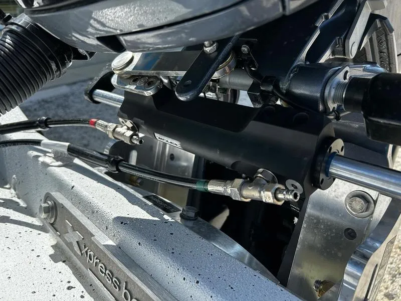 Slide: The Image of Close-up of 2025 Xpress H22B boat engine components and hydraulic connections. - 15
