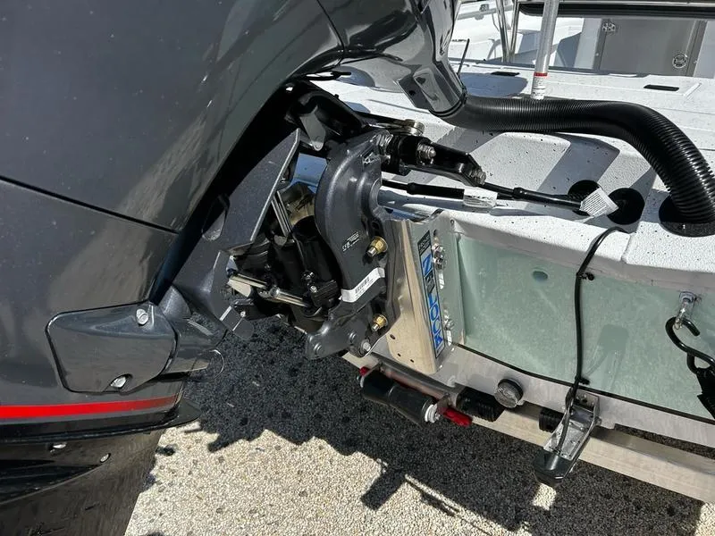 Slide: The Image of Outboard motor on 2025 Xpress H22B boat, showing detailed mounting and components. - 17