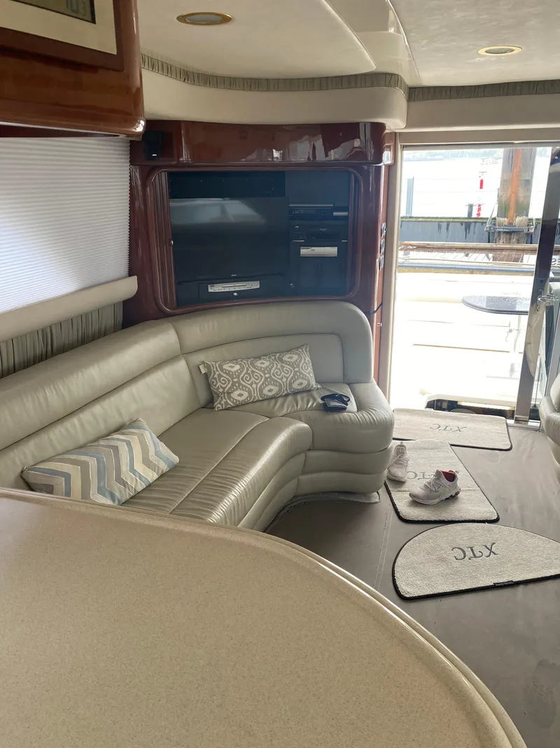 Slide: The Image of Luxurious interior of 2002 Sea Ray 56 Sedan Bridge yacht with leather seating and modern amenities. - 11