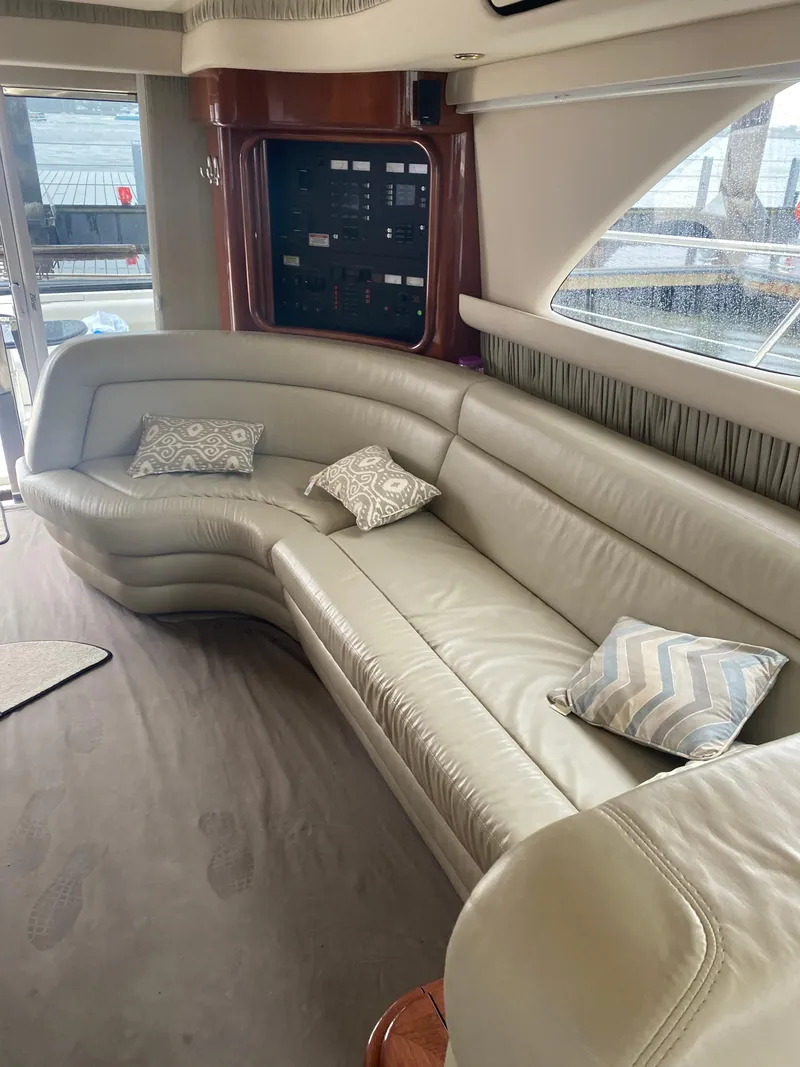 Slide: The Image of Luxurious interior of a 2002 Sea Ray 56 Sedan Bridge yacht with plush seating. - 12