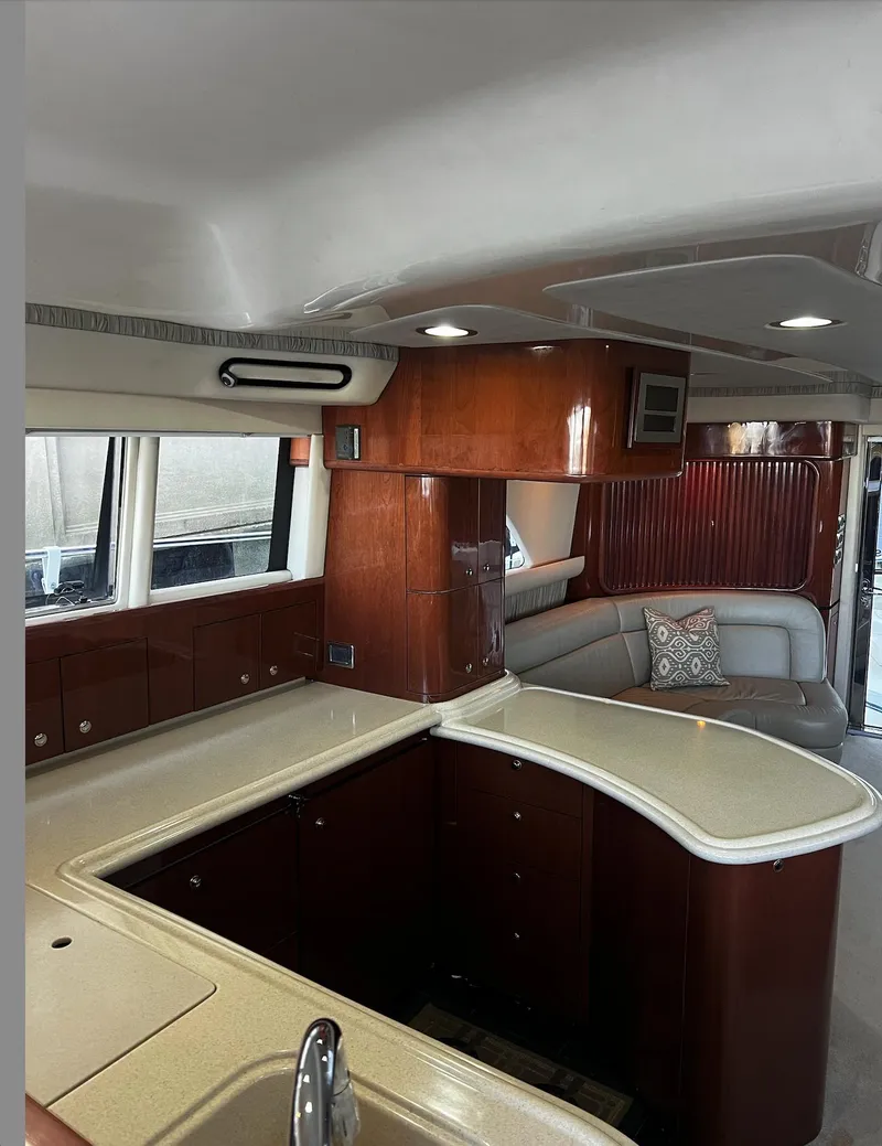 Slide: The Image of Interior of 2002 Sea Ray 56 Sedan Bridge yacht with elegant wood cabinetry and modern design. - 14
