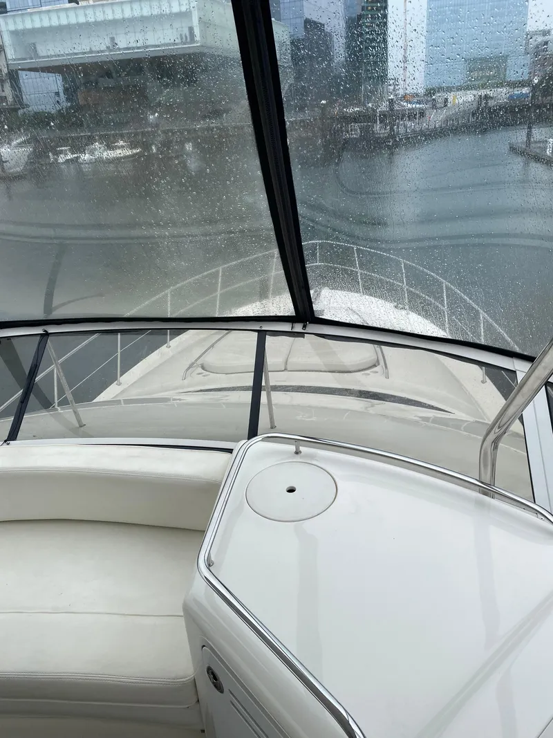 Slide: The Image of 2002 Sea Ray 56 Sedan Bridge yacht interior with waterfront view. - 18
