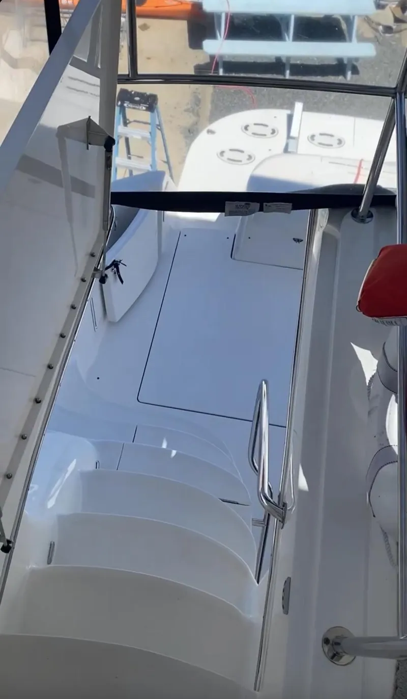 Slide: The Image of 2002 Sea Ray 56 Sedan Bridge yacht interior with stairs and seating area. - 19