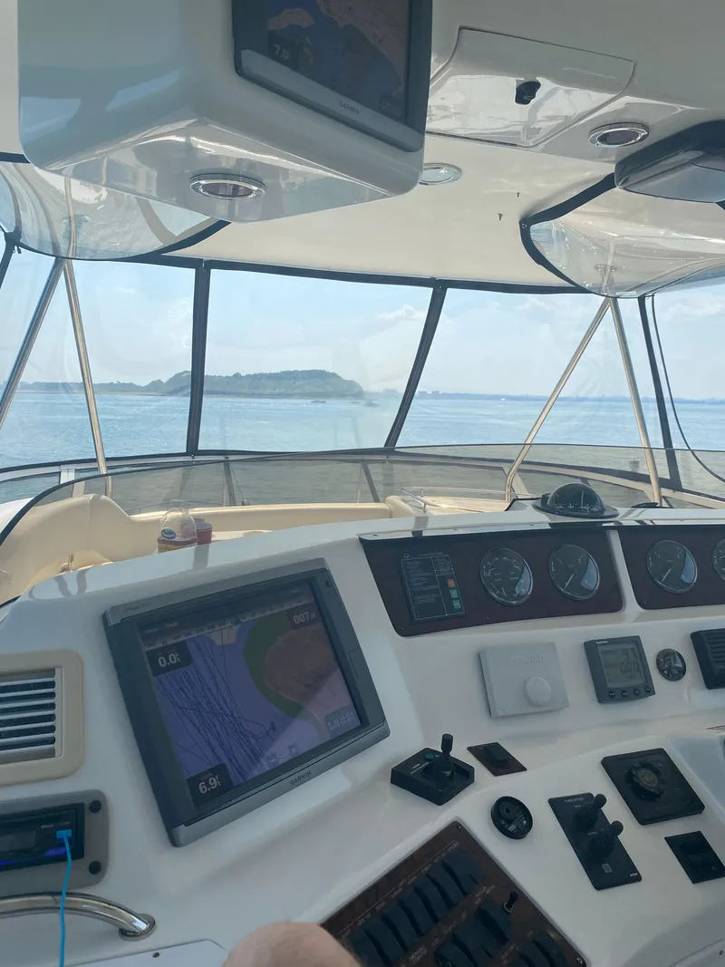Slide: The Image of Interior view of 2002 Sea Ray 56 Sedan Bridge yacht cockpit with navigation equipment. - 20