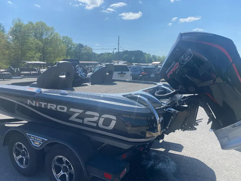 Slide: The Image of Nitro Z20 Pro 2022 boat with powerful engine, parked outdoors under clear sky. - 4