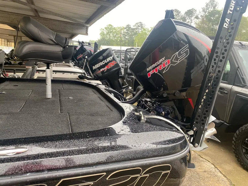 Slide: The Image of 2022 Nitro Z20 Pro boat with Mercury Pro XS engines, parked under a shelter. - 4