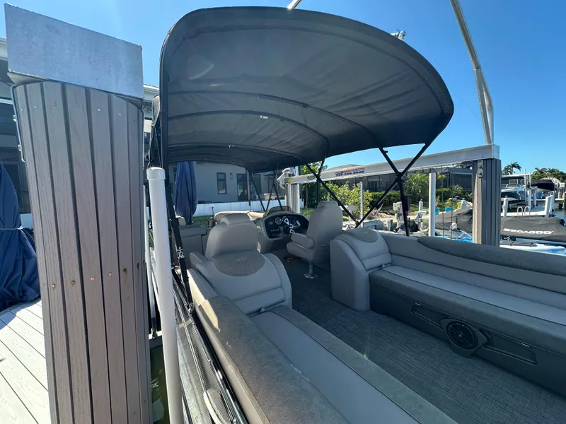 Slide: The Image of 2020 Avalon Catalina Platinum Quad Lounger boat with canopy at dock. - 22