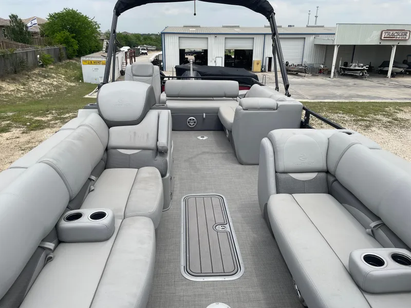 Slide: The Image of 2023 Regency 250DL3 pontoon boat with spacious seating and modern design. - 13