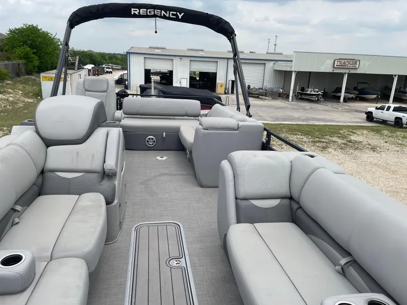 Slide: The Image of 2023 Regency 250DL3 pontoon boat with spacious seating and modern design. - 14