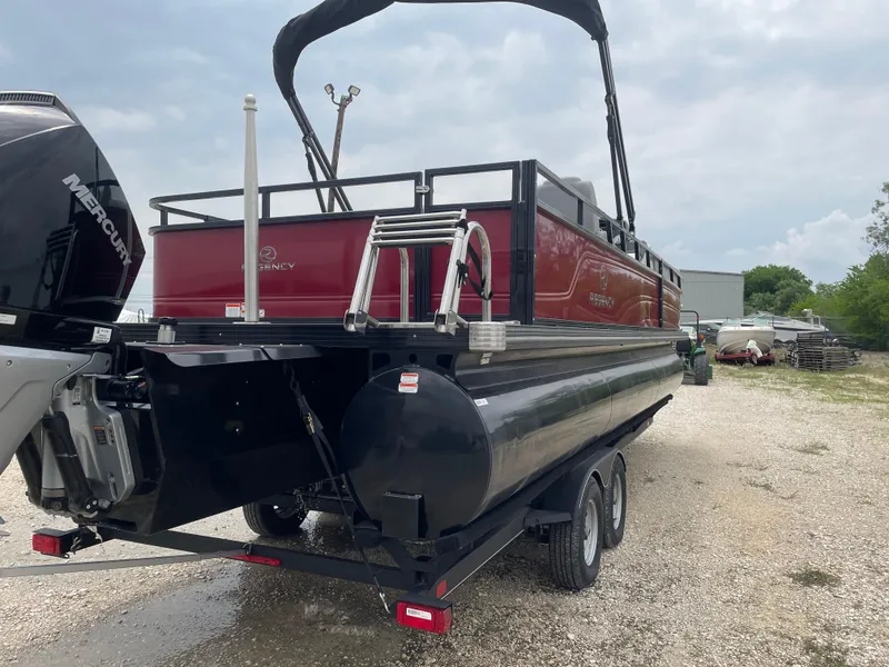 Slide: The Image of 2023 Regency 250DL3 pontoon boat on trailer, featuring a sleek red and black design. - 4