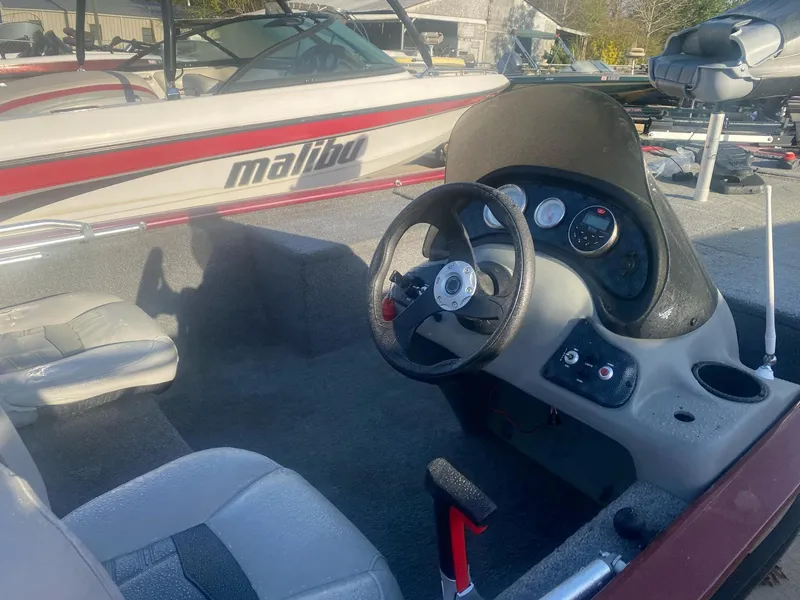 Slide: The Image of 2018 Tracker Pro 170 boat interior with steering wheel and dashboard controls. - 8