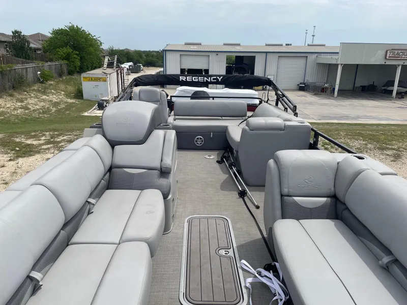 Slide: The Image of 2023 Regency 250DL3 pontoon boat with spacious seating and modern design. - 14