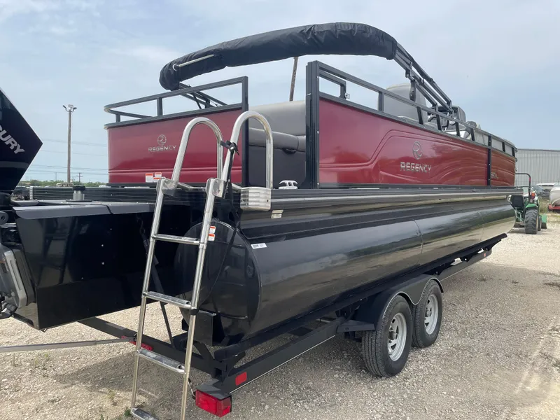 Slide: The Image of 2023 Regency 250DL3 pontoon boat on trailer, featuring a sleek red and black design. - 6