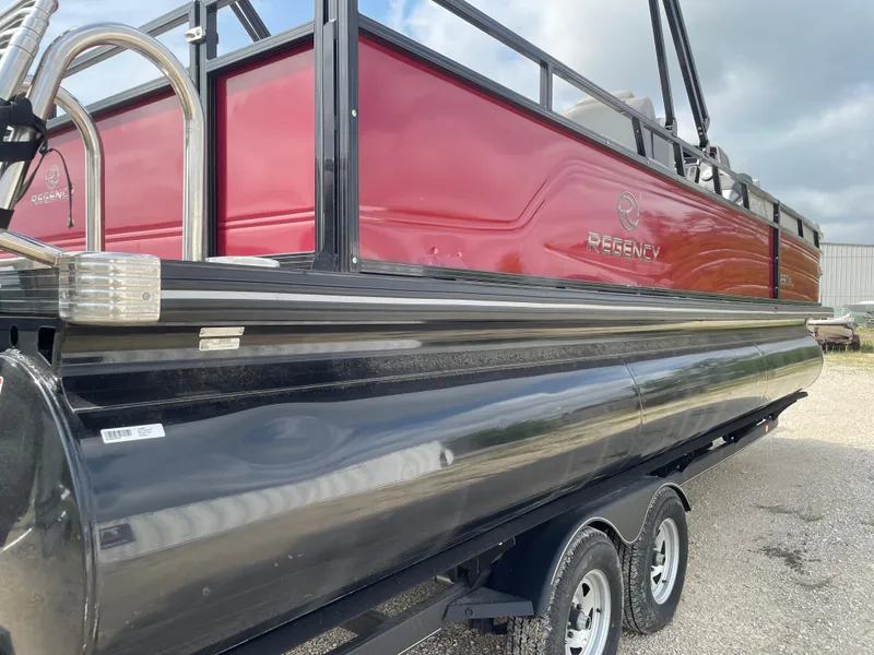 Slide: The Image of 2023 Regency 250DL3 boat with Mercury outboard motor in sunlight. - 11