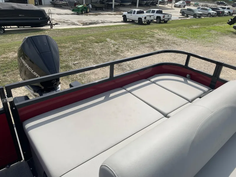 Slide: The Image of 2023 Regency 250DL3 pontoon boat with spacious seating and modern design. - 15