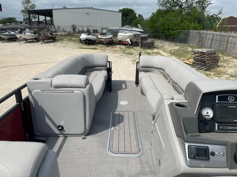 Slide: The Image of 2023 Regency 250DL3 pontoon boat with spacious seating and powerful outboard motor. - 17