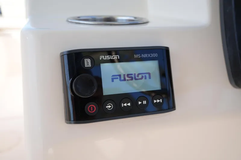 Slide: The Image of Fusion MS-NRX300 stereo system on 2021 Grady-White Freedom 235 boat dashboard. - 24