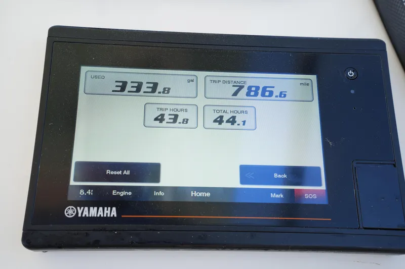 Slide: The Image of Yamaha display showing fuel usage and trip data on a 2021 Grady-White Freedom 235. - 27