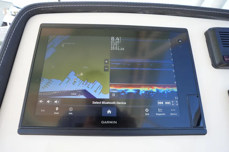 Slide: The Image of Garmin navigation display on 2021 Grady-White Freedom 235 boat dashboard. - 28