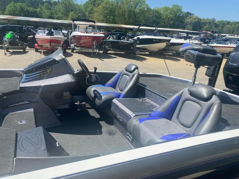 Slide: The Image of 2017 Ranger Z-520 "RANGER CUP EDITION" boat with dual seats, parked among other boats. - 5