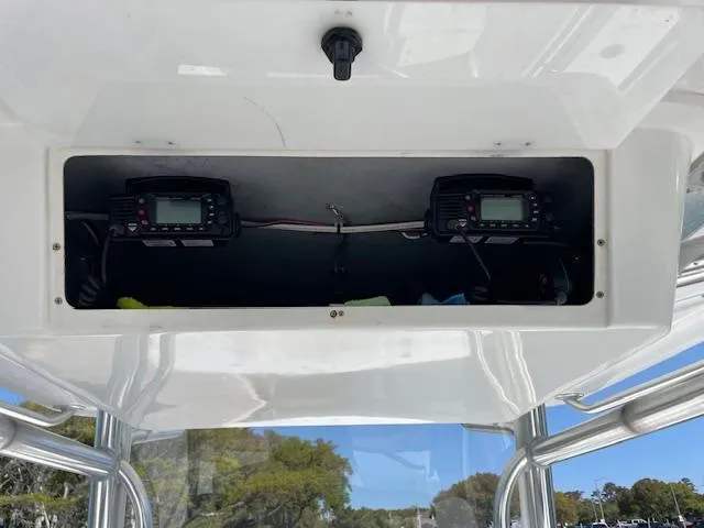 Slide: The Image of 2007 Southport 28 CC boat electronics compartment with dual marine radios. - 10