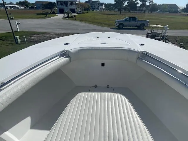 Slide: The Image of 2007 Southport 28 CC boat interior with white seating and open deck view. - 16