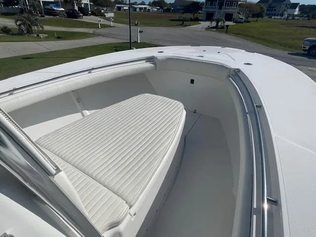 Slide: The Image of 2007 Southport 28 CC boat with spacious white seating area and sleek design. - 17
