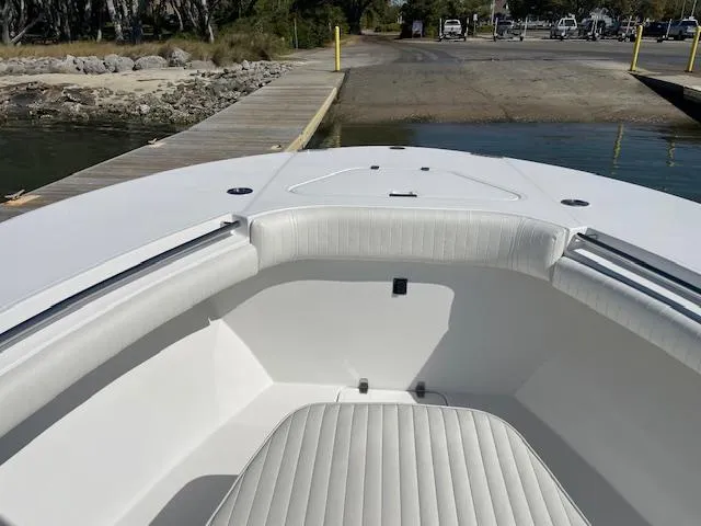 Slide: The Image of 2007 Southport 28 CC boat interior with white seating at dock. - 18