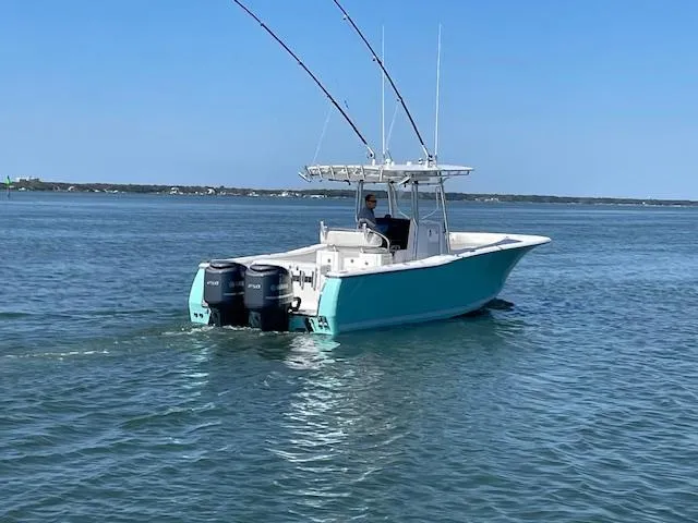 Slide: The Image of 2007 Southport 28 CC boat cruising on open water with dual engines. - 27