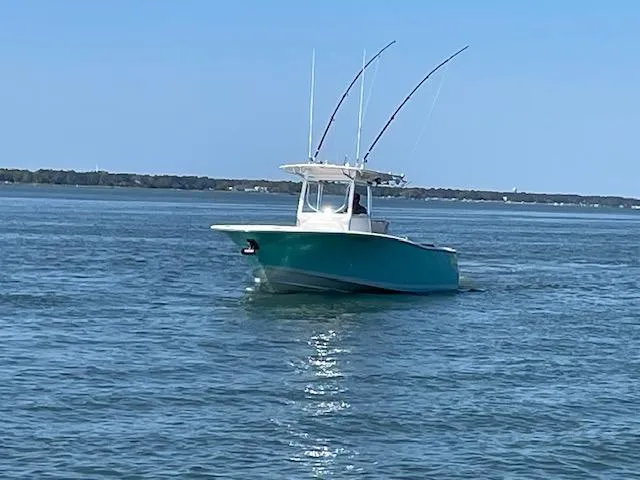 Slide: The Image of 2007 Southport 28 CC boat on calm water under clear blue sky. - 28