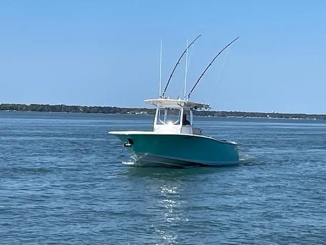 Slide: The Image of 2007 Southport 28 CC boat cruising on calm waters under clear blue sky. - 30