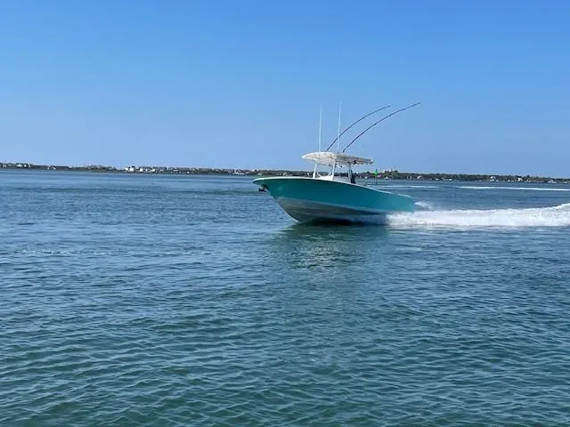 Slide: The Image of 2007 Southport 28 CC boat cruising on open water under clear blue sky. - 36