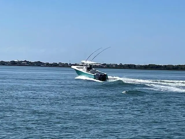 Slide: The Image of 2007 Southport 28 CC boat cruising on open water under clear blue sky. - 37