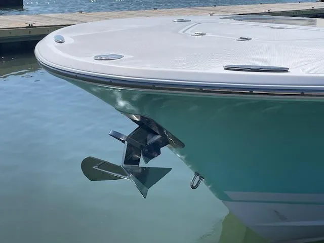 Slide: The Image of 2007 Southport 28 CC boat bow with anchor, docked on calm water. - 4