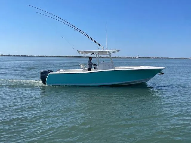 Slide: The Image of 2007 Southport 28 CC boat cruising on calm waters under a clear blue sky. - 40