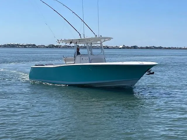 Slide: The Image of 2007 Southport 28 CC boat cruising on calm water under clear blue sky. - 41